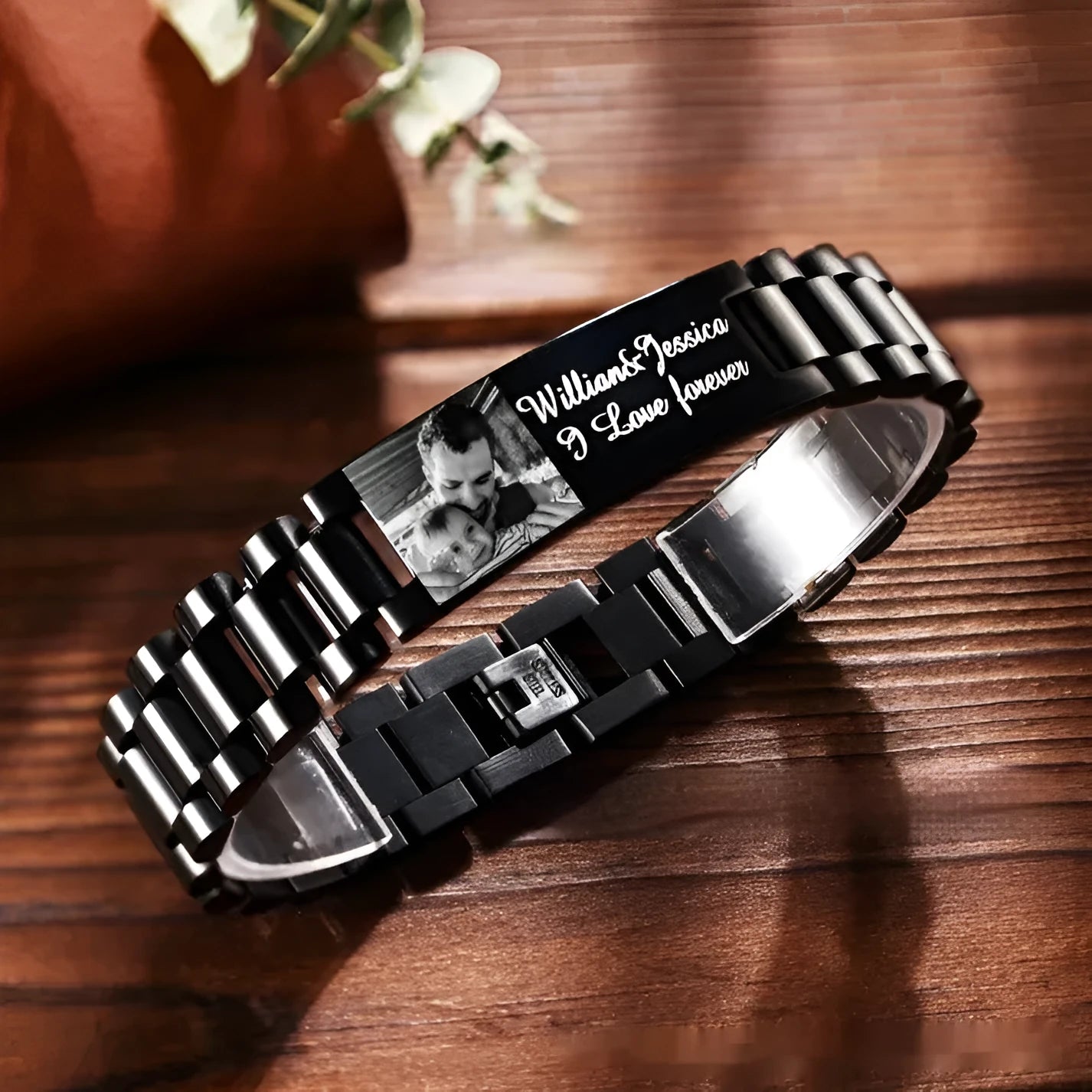 Men's curved heart-shaped stainless steel bracelet with engraved lettering, presented in a gift box.