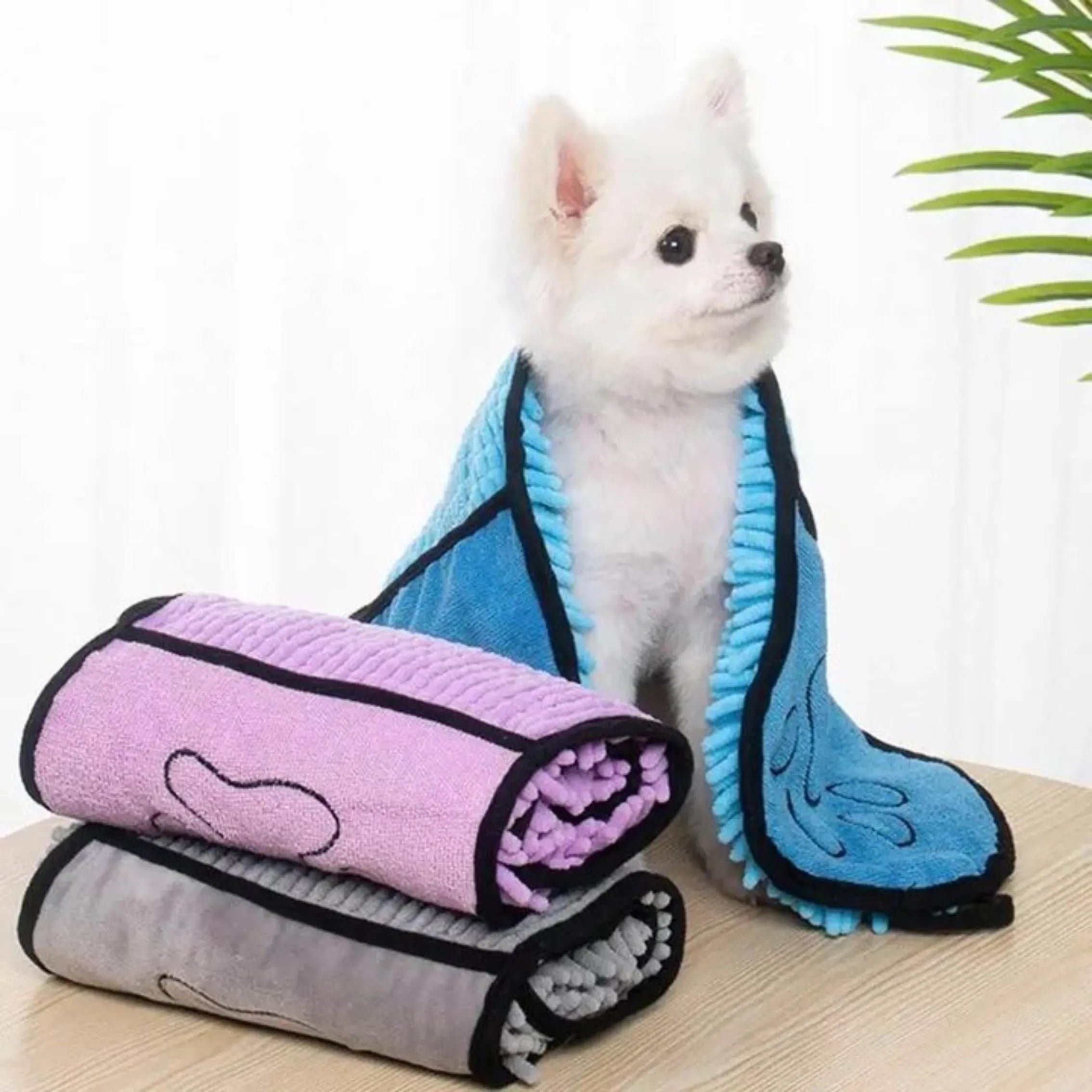 Blue dog bath robe towel laid flat showing 62cm by 23cm size and soft fibre texture
