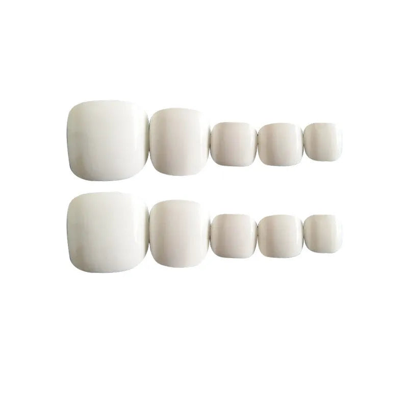 Set of white false nails with a starry sky pattern, includes glue for application.