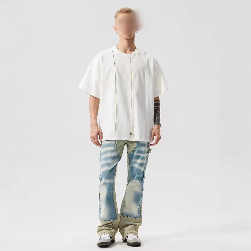 Retro yellow and blue dual-colour patchwork splash-ink damaged design jeans with mid waist and zip fly.