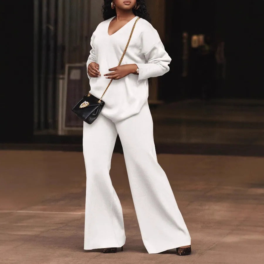 Brown women's long-sleeve suede top and trousers two-piece casual suit on a hanger.