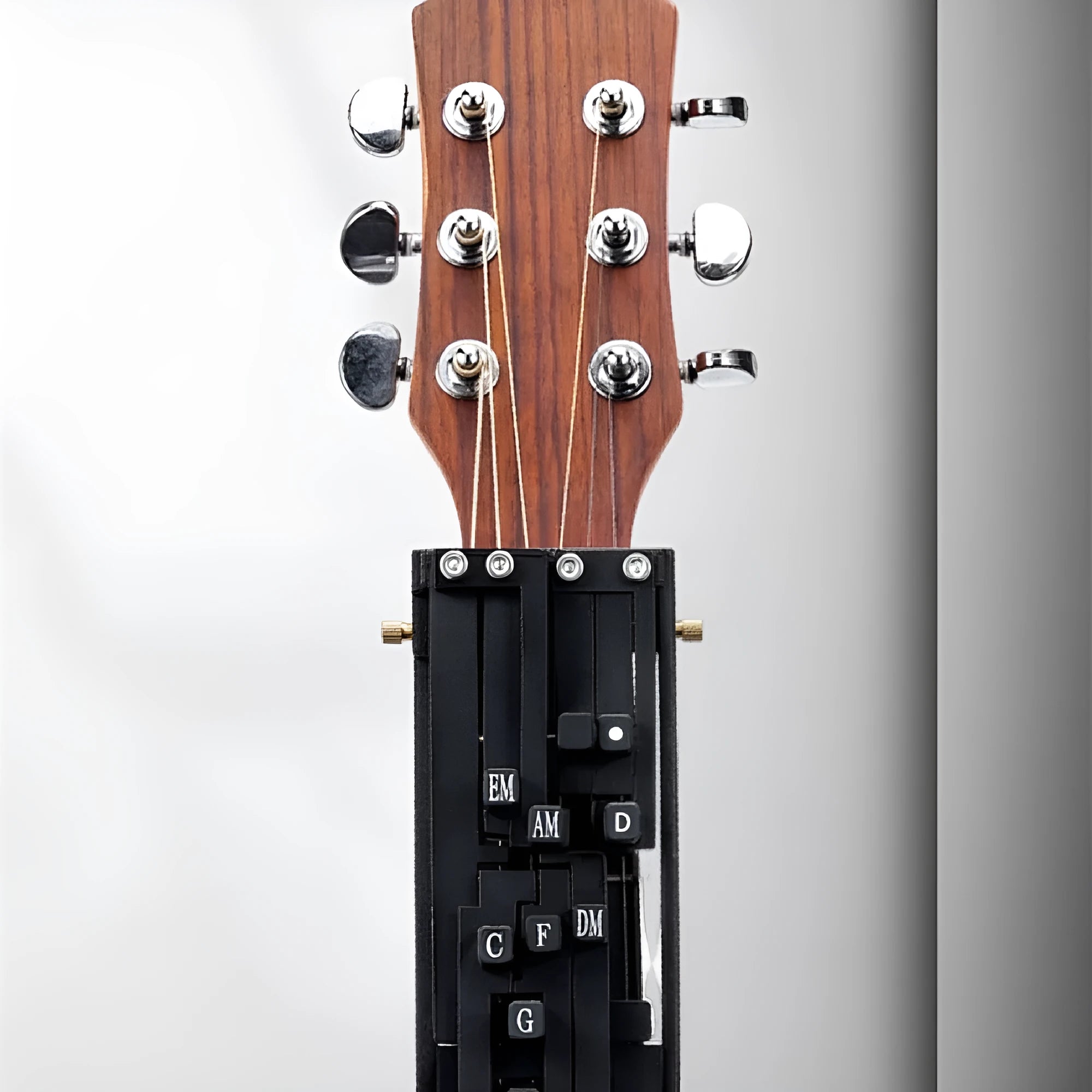 Automatic chord device for folk guitar practice with black or white chord options