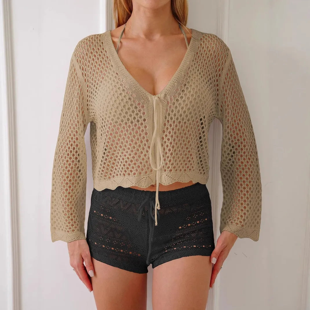 Women's apricot hollow woven cardigan blouse with bell sleeves, shown laid flat.