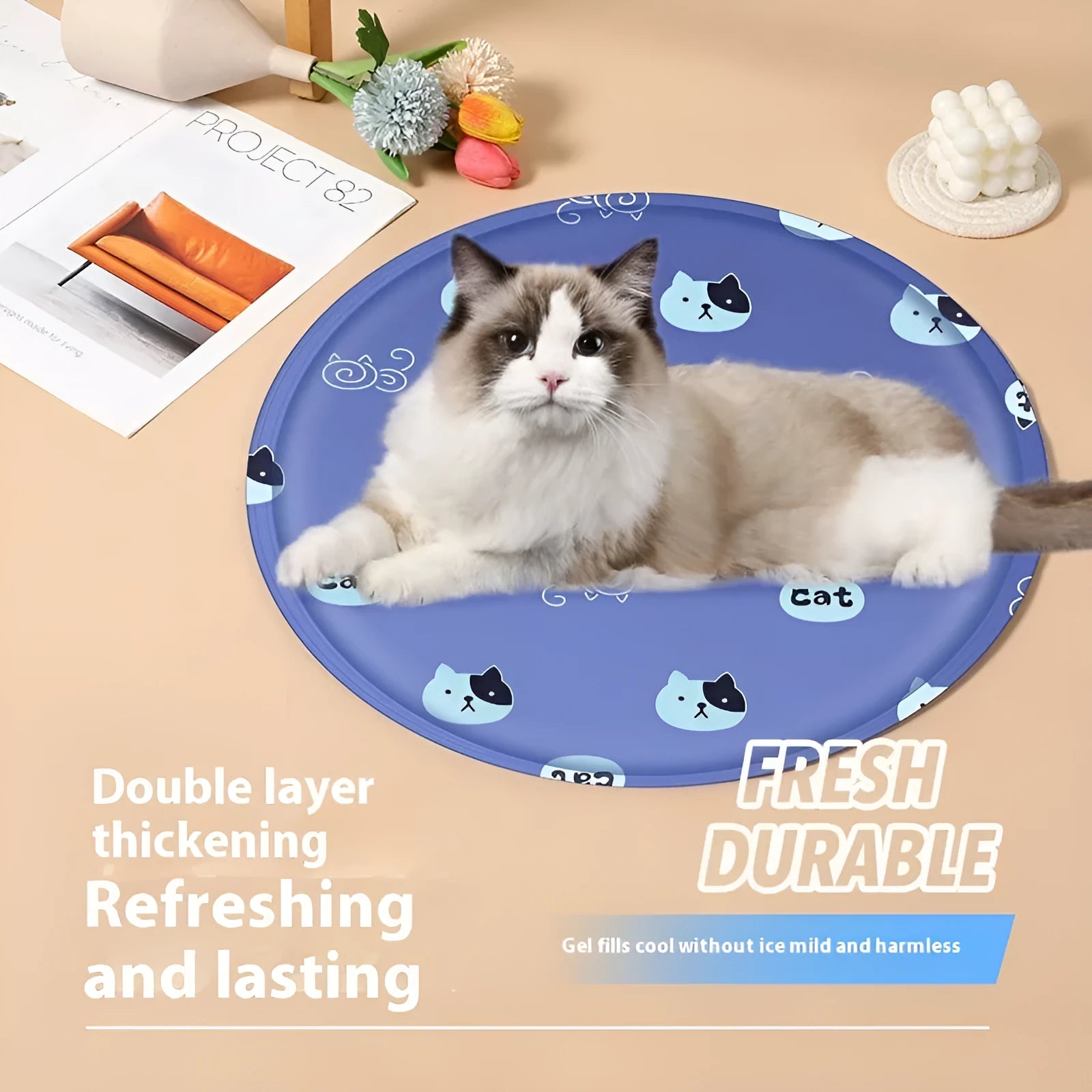 Round cloth dog cooling mat with cartoon design in blue paw print pattern.