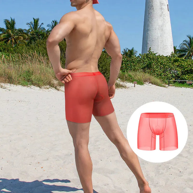 Men's solid colour ice silk boxer shorts in orange, pink, and red on a white background.