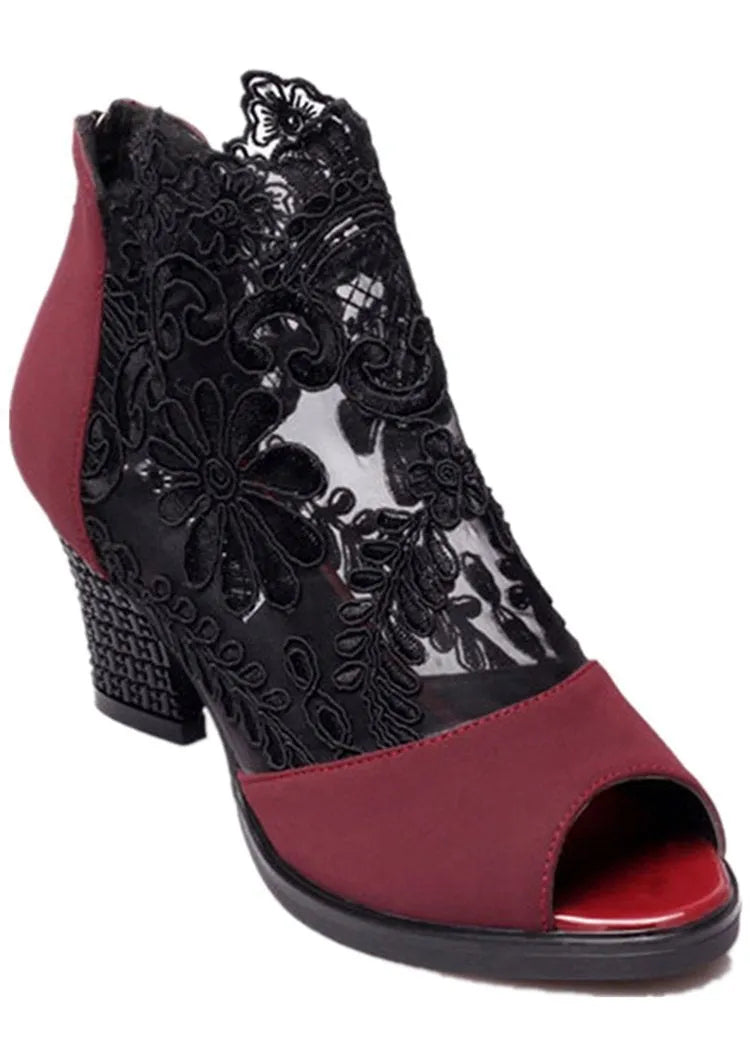 Women's black gladiator sandals with flower lace detailing, square heels, and zip closure