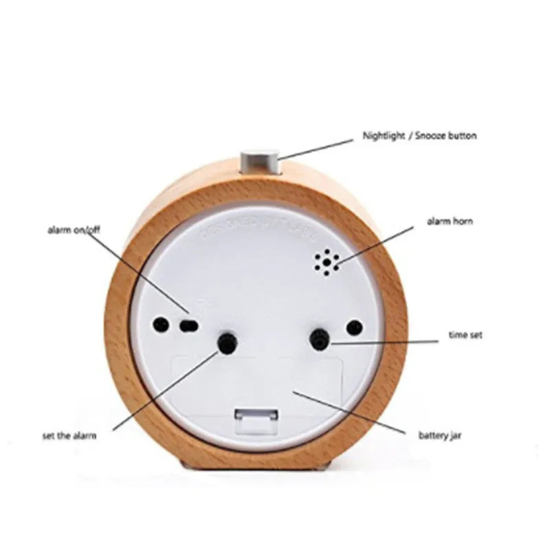 Solid beech wood square alarm clock with traditional analogue dial on wooden surface