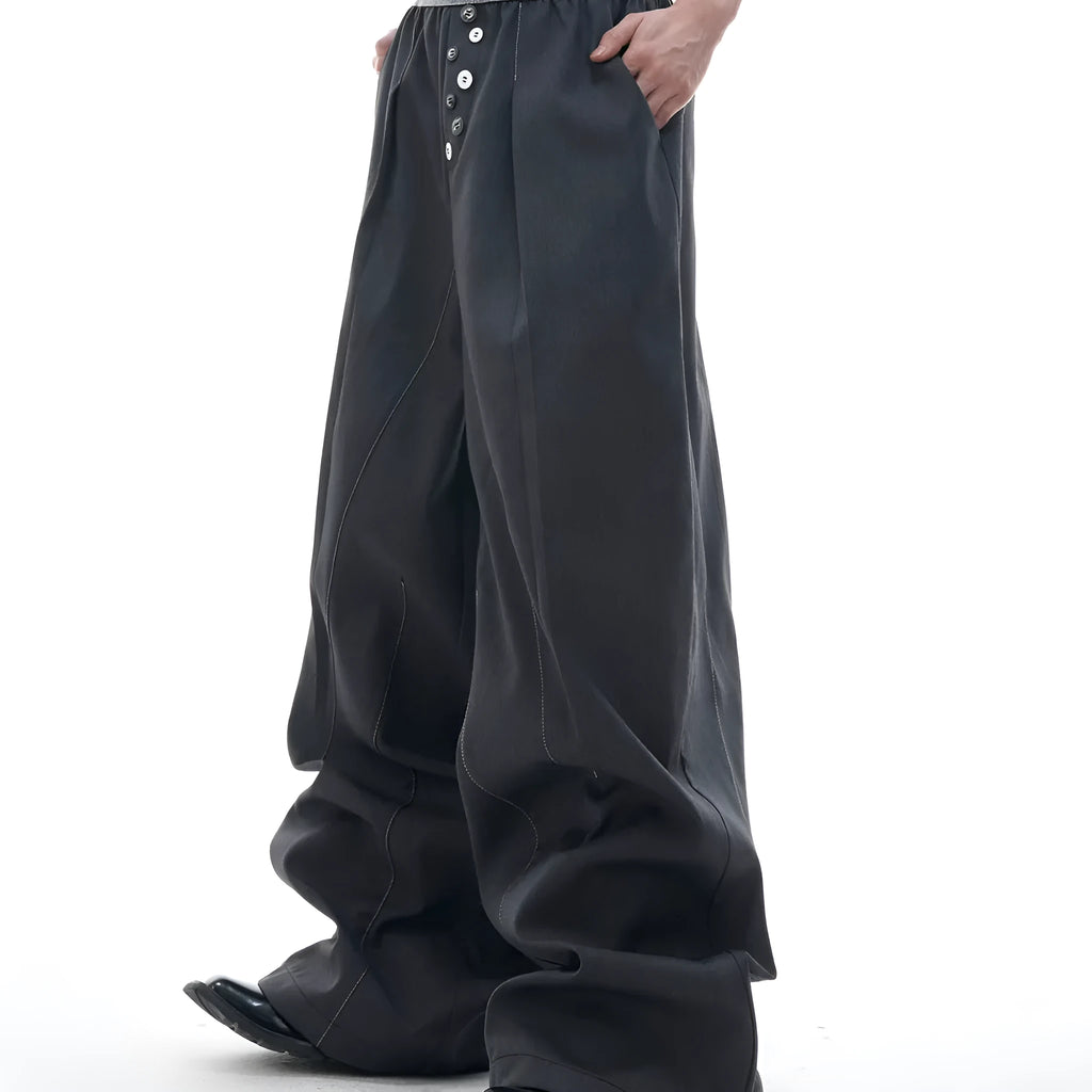 High-waisted straight-leg trousers in grey featuring a button-open line design detail on the leg.