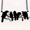 Black crow necklace with Gothic styling and cross chain design