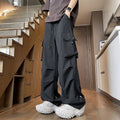 Plus size straight-leg waterproof trousers in black, grey, or white, showing drawstring waist and thin polyester fabric.