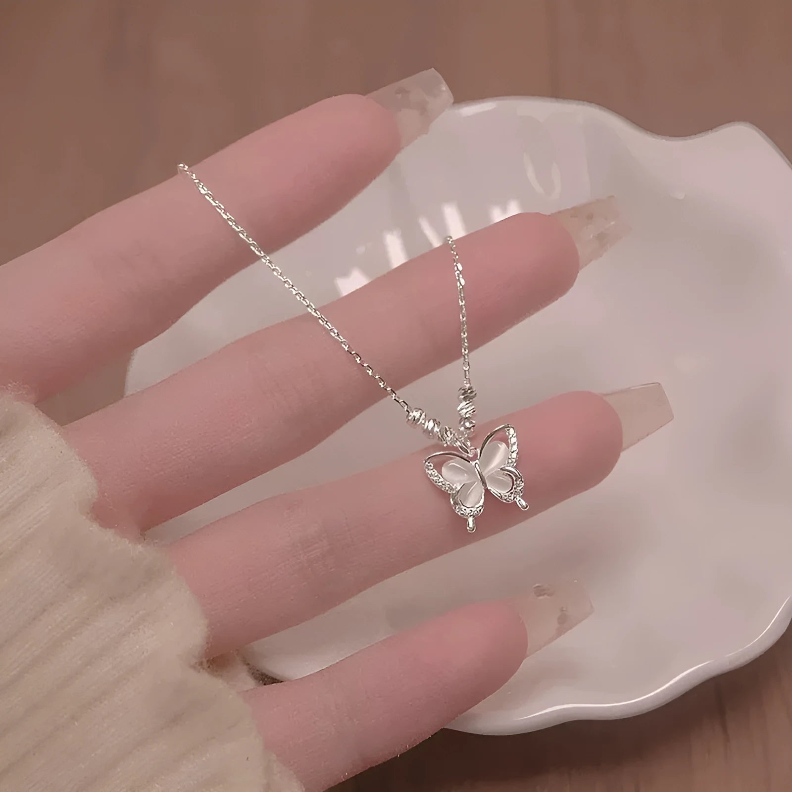 Silver opal butterfly pendant necklace on a cross chain, adjustable 41-50cm, made of 925 sterling silver.
