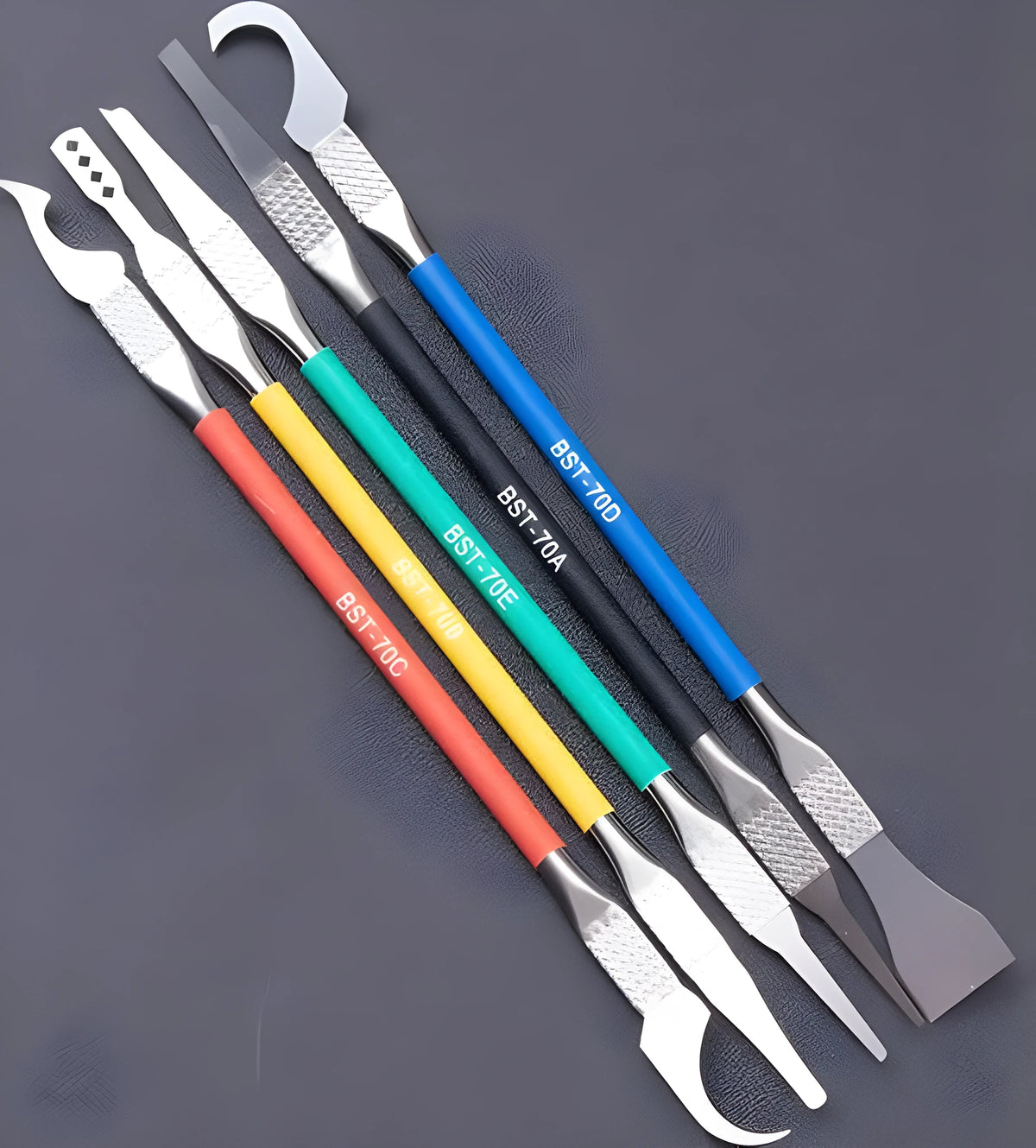 Five-piece stainless steel disassembly tool set with thin blades for plastic removal.