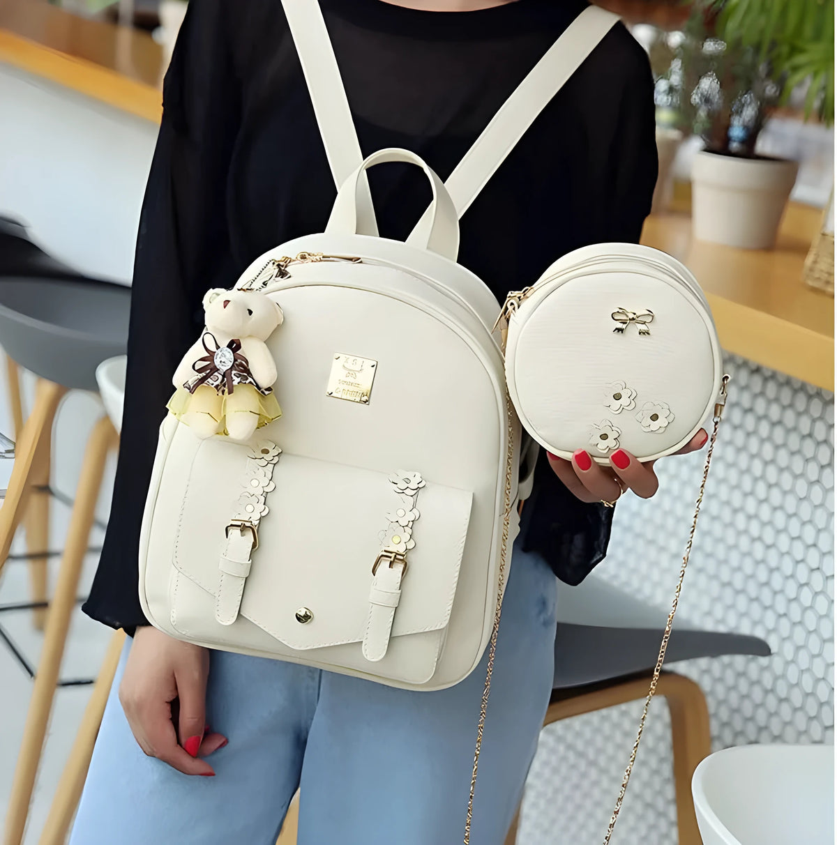 Women's three-piece leather backpack set with floral design showing backpack, shoulder bag, and card holder