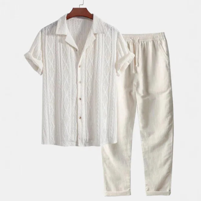 Men's slim fit camouflage print linen-style suit with short sleeve shirt and trousers on a hanger.