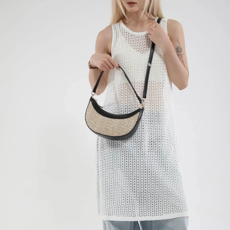 Hard straw crossbody dumpling bag showing sandwich pocket and internal zipper compartments