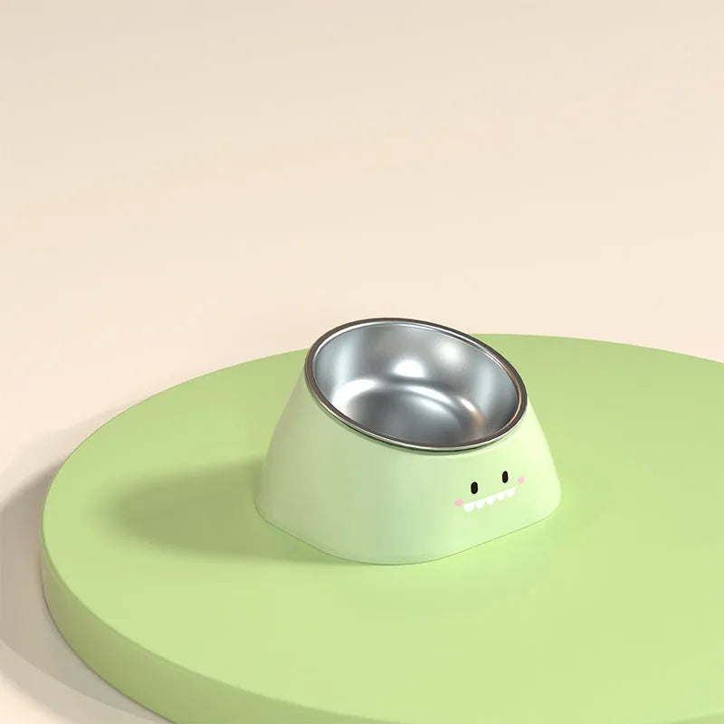Green tilted stainless steel cat bowl with non-slip white base at a 15 degree angle