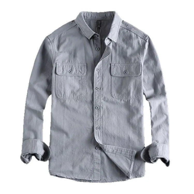 Man wearing a loose-fit grey long sleeve cardigan-style shirt, showcasing its relaxed silhouette and polyester material.