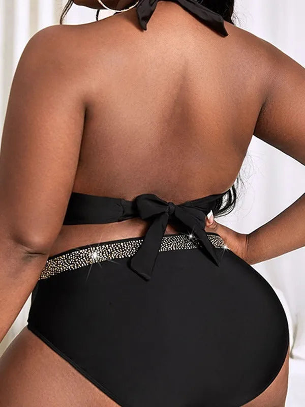 Black plus size women's bikini set with matching bra and shorts for swimming