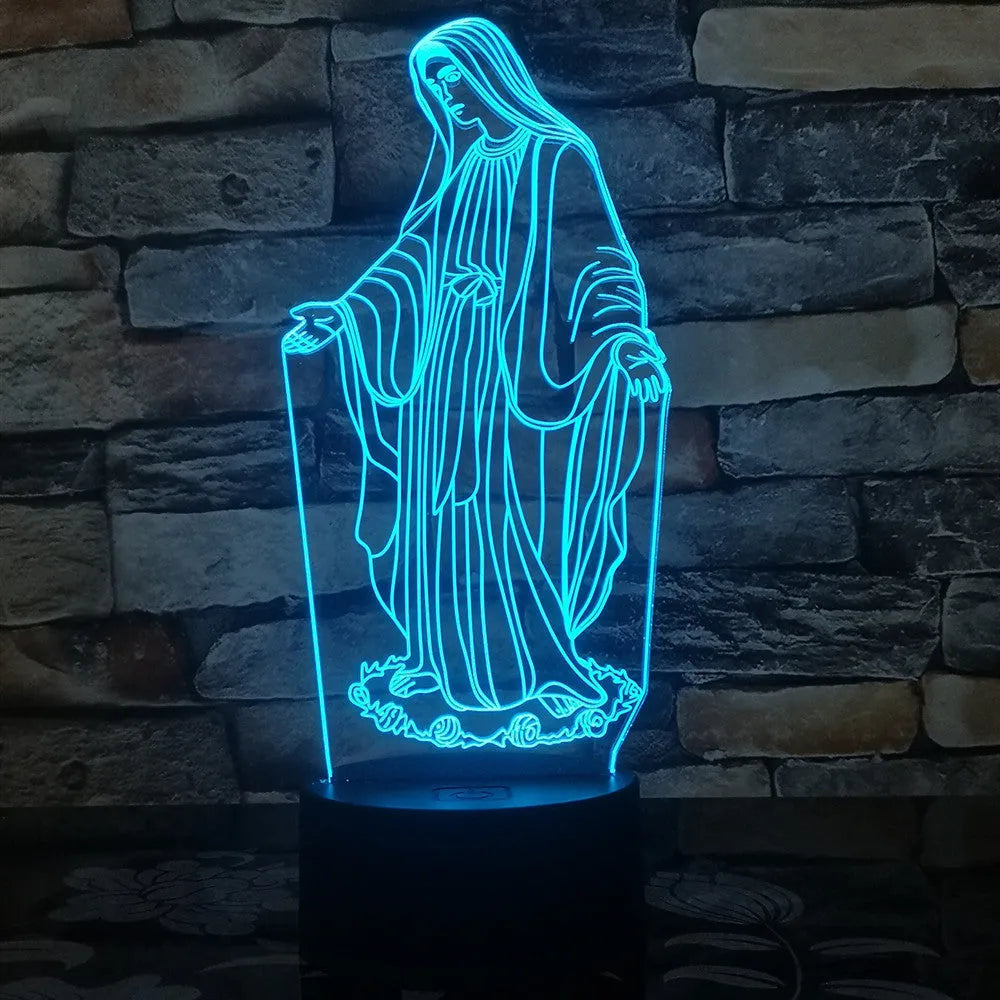 3D LED night light showing colourful dual ring pattern on acrylic panel, with remote control on desk.