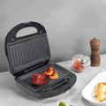 Black double-sided electric sandwich pan body with brushed stainless steel top and indicator light