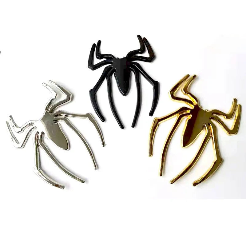 Three-dimensional metal spider car sticker in gold, silver, black, or red.
