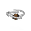 Women's silver Saturn tigereye open ring with adjustable opening and white gold colour finish.