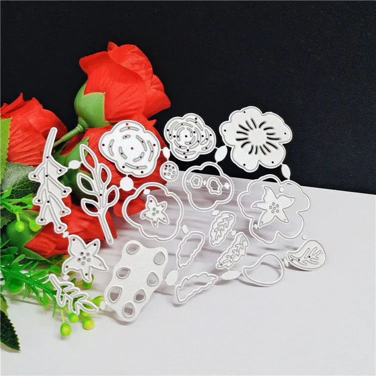 Silver carbon steel paper cutting die with floral plant design measuring 14.3 by 9.9 cm