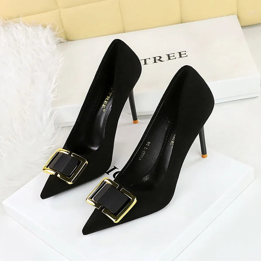 Black suede women's stiletto high heels with a pointed toe and 9cm heel on a rubber sole.