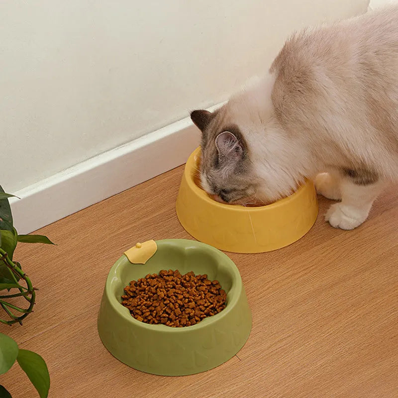 Green flower-shaped plastic pet bowl for cat or small dog food and water.