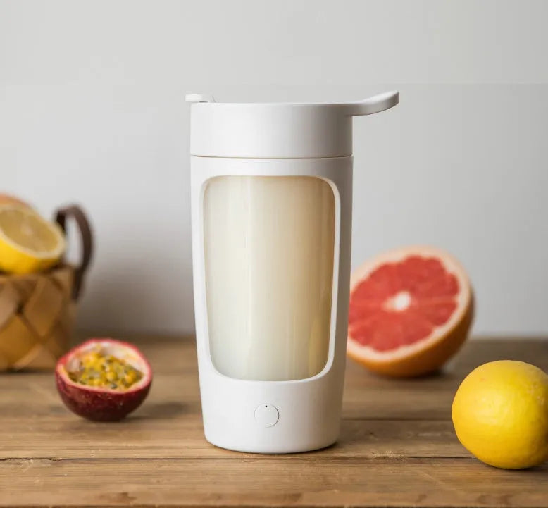 Portable juice blender with 650ml capacity in black blue pink or white featuring automatic mixing motor
