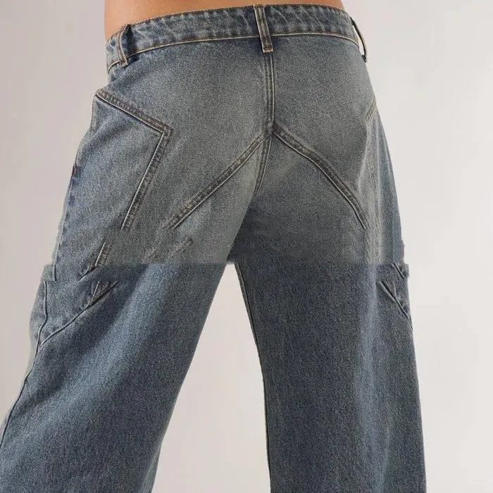 Blue loose fit cotton wide leg trousers with low waist and colour splicing detail laid flat.