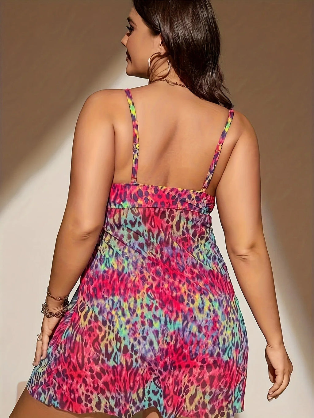 Plus size red skirt bikini set on a mannequin, showing sleeveless top and split skirt bottom design.