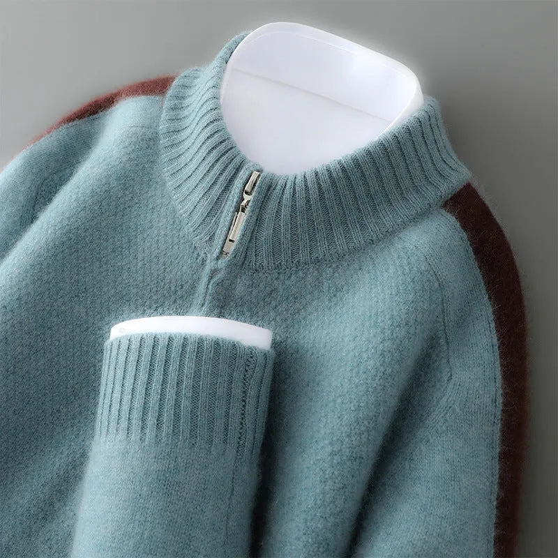 Slim fit grey sheep wool knitted sweater with a half-height zip and round neck on a hanger.