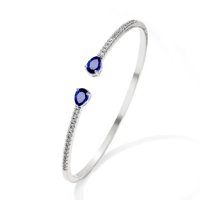 Copper bracelet with multi-zircon decorative inlay in simple style, shown in blue and white colour options