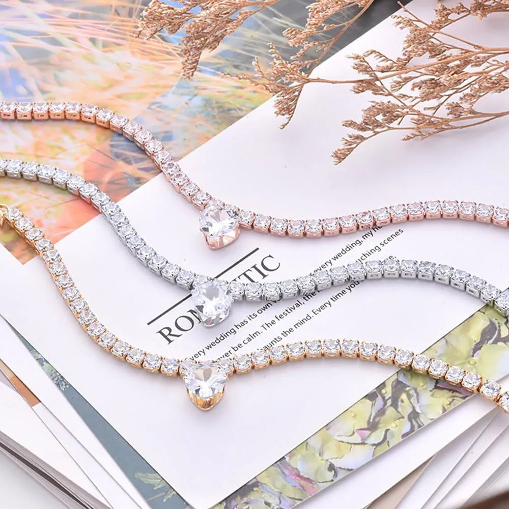 Gold rhinestone heart-shaped decorative collar for dogs and cats with extension chain.