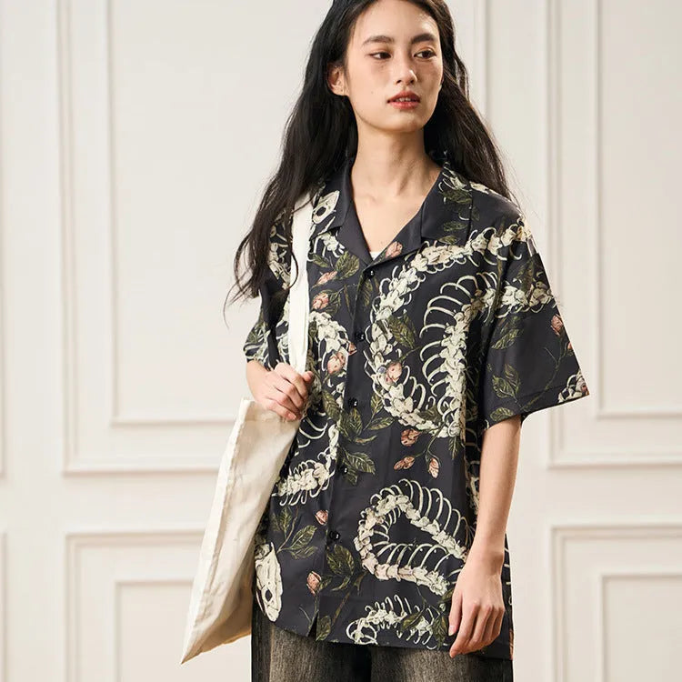 Short sleeve Cuban collar shirt with printed snake bone floral pattern in loose fit.