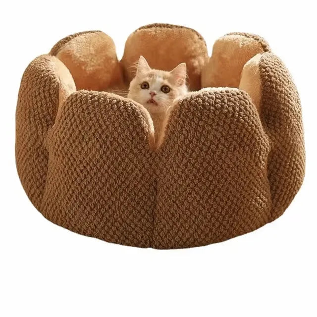 Green cactus petal shaped enclosed plush bed for a cat or small dog on a hardwood floor.