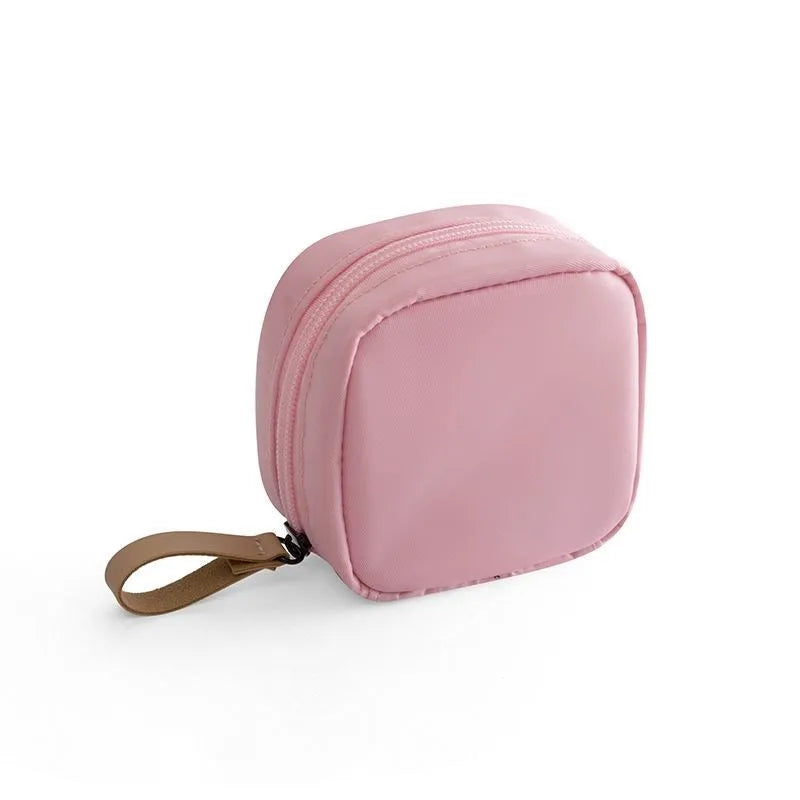 Cube-shaped cloth makeup storage bag in blue, pink, white, or white pink colour options