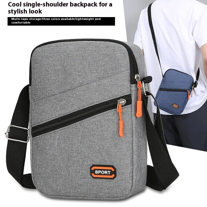 Oxford cloth crossbody commuter bag in solid colour with contrast design