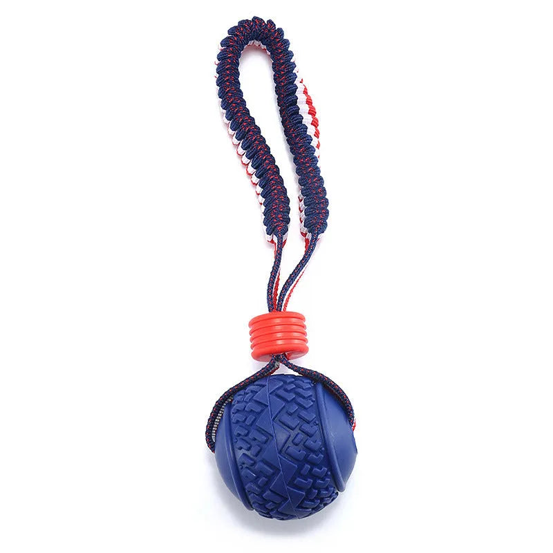 Blue rubber dog ball with attached rope toy for tug of war and dental cleaning