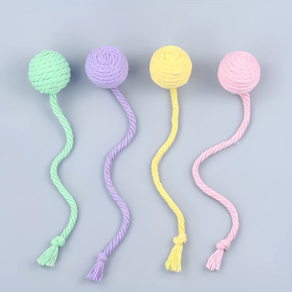 Colourful cat toy ball with attached rope and internal bell for interactive feline play