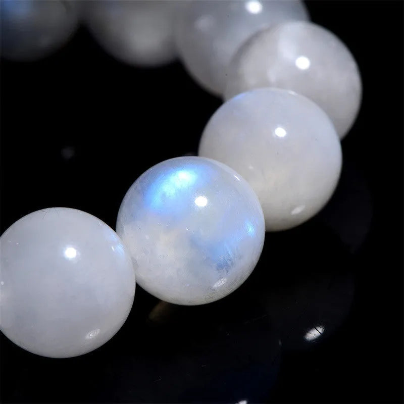 Natural blue moonlight moonstone round bead bracelet on wrist showing geometric arrangement