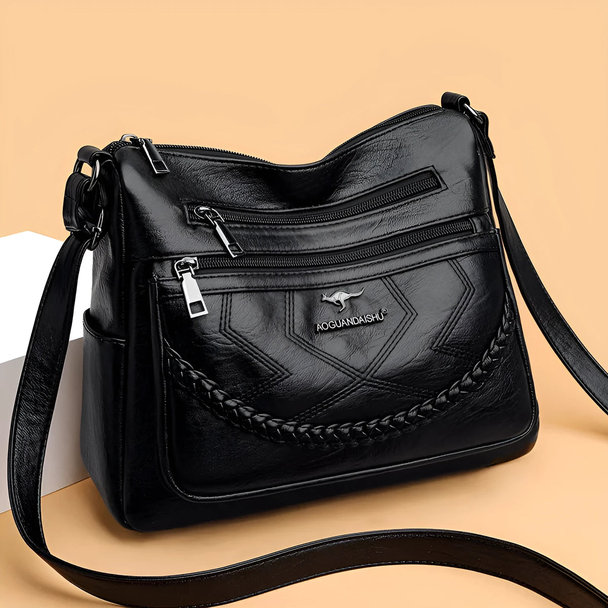 Soft black PU leather women's crossbody bag showing square shape and outer pocket