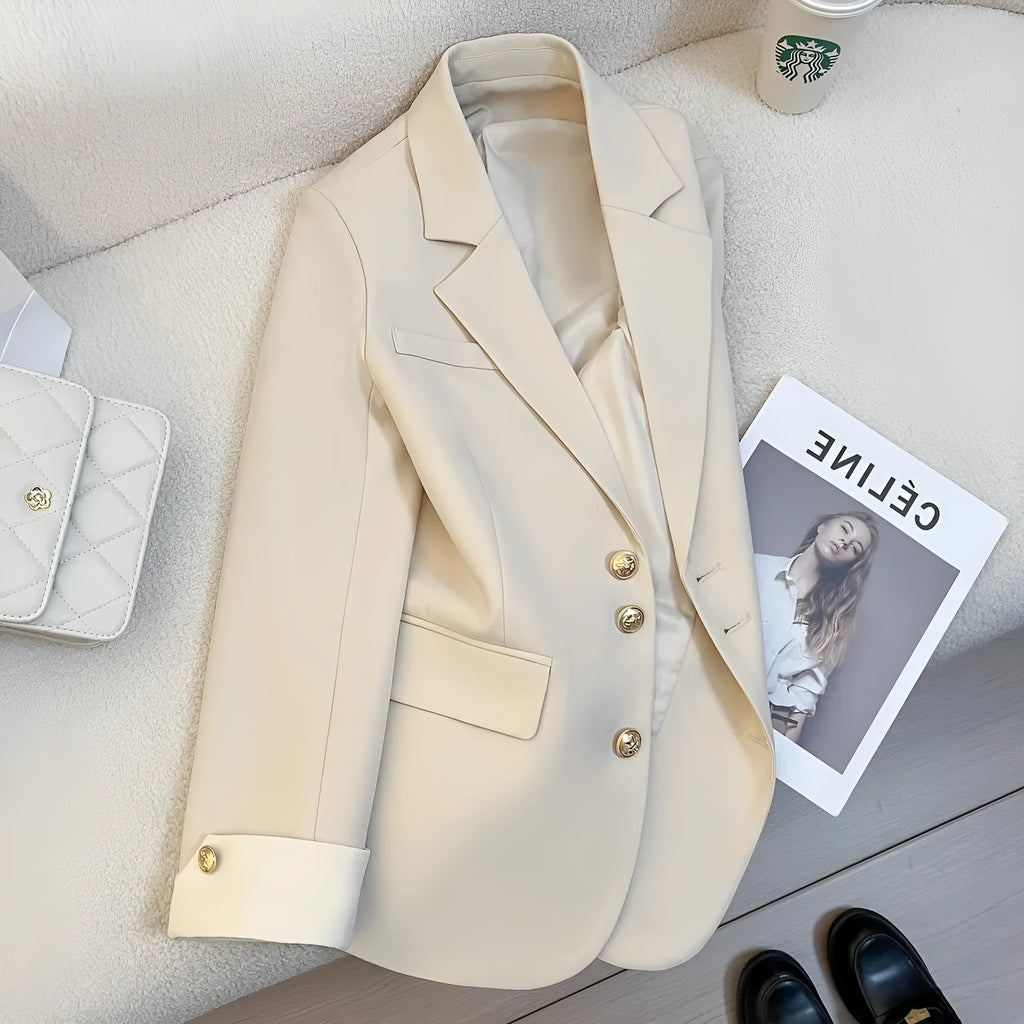 Korean-style loose fit women's trench coat in milky white with long sleeves and pockets.