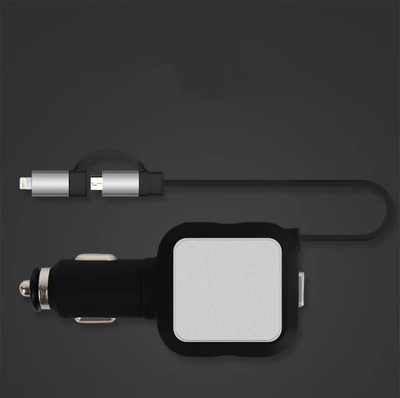 Black and gold dual USB car charger with retractable cable plugged into a car dashboard