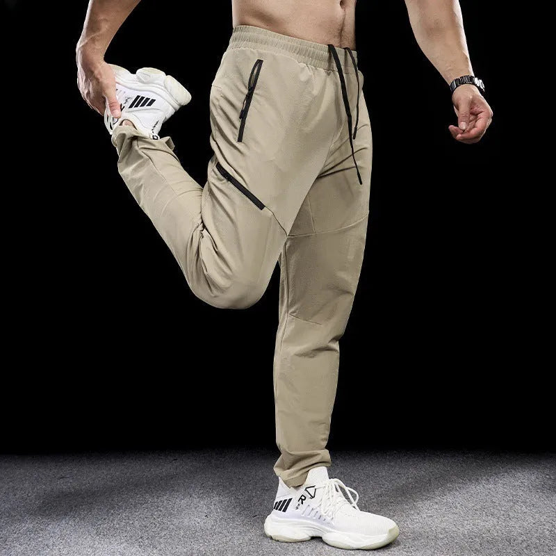 Men's black waterproof quick-drying nylon workout pants for sports and exercise.