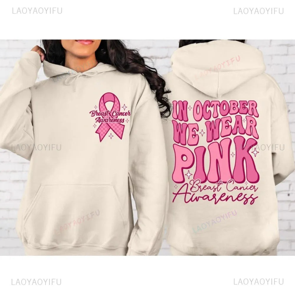 Breast cancer awareness pullover hoodie in pink with retro art design and a side seam pocket.