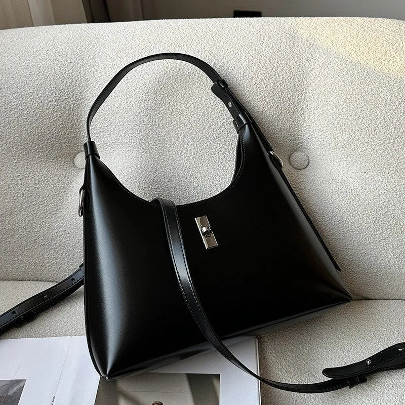 Genuine leather dumpling-shaped crossbody bag with shoulder strap and multiple pockets