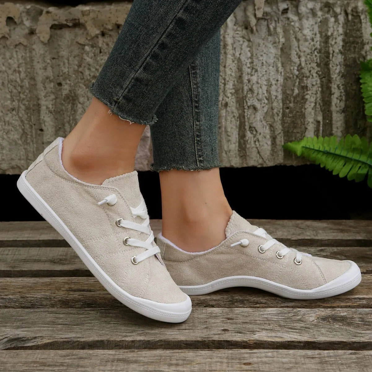 Women's creamy-white fabric casual sneakers with low-top design and rubber soles