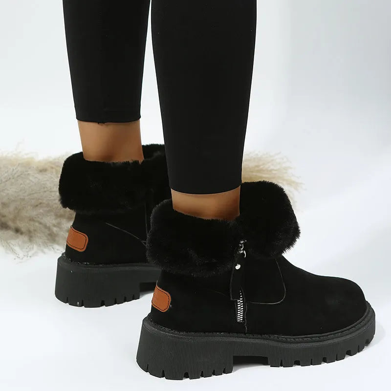 Women's black high-top faux suede snow boot with side zipper and non-slip sole.